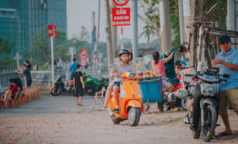 Person enjoying a scooter ride through the city