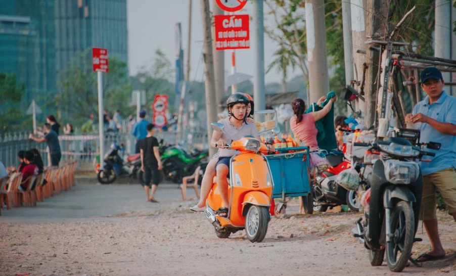 Person enjoying a scooter ride through the city